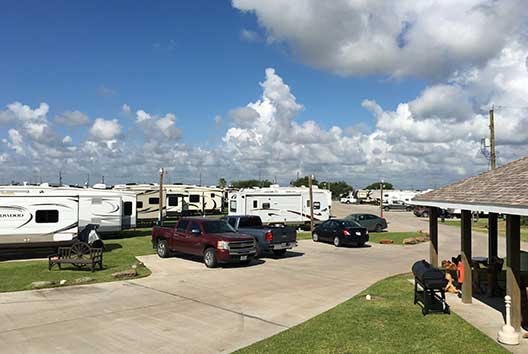 Row of RV sites with concrete pads and full hookups