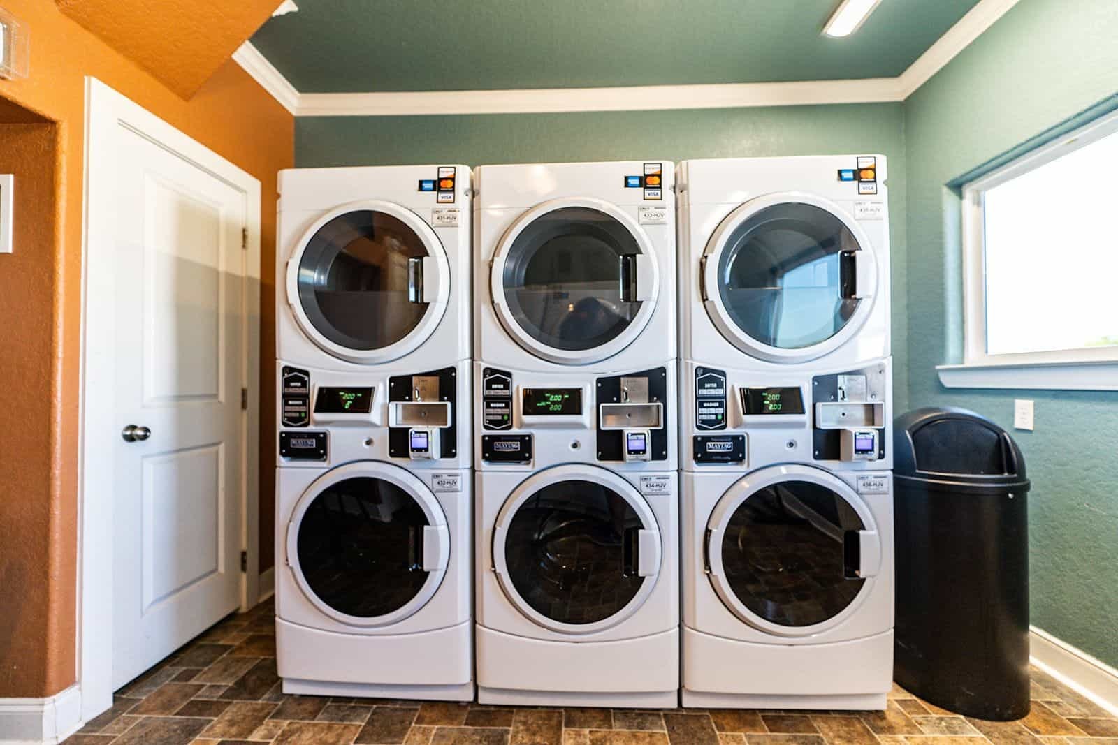 Commercial Maytag laundry facility with stacked washer and dryer units — Gulf Coast 5 Star RV Resort